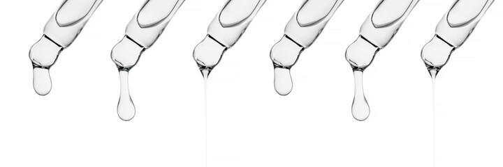 A banner with several pipettes with serum or other cosmetic product.