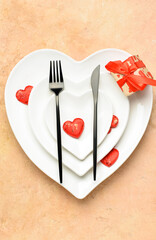 Beautiful table setting for Valentine's Day on beige background