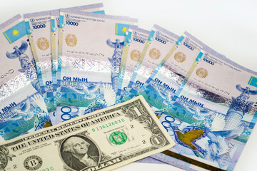 One dollar against the background of tenge bills, the growth of the dollar affects the tenge.