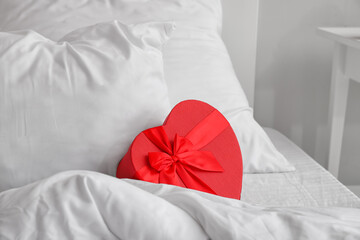 Fototapeta na wymiar Gift for Valentine's Day on bed
