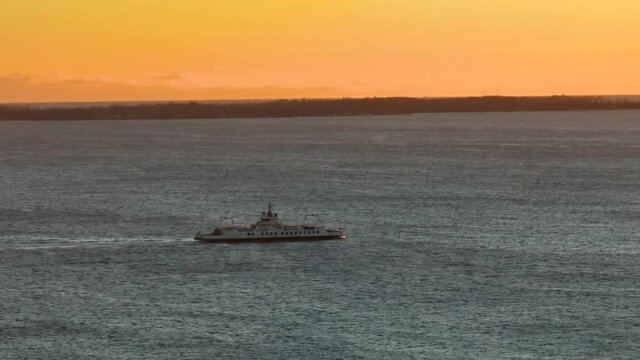 Ferry sailing on lake  at dusk