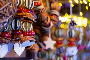 Suspended Christmas decorations at the fair. Close-up image