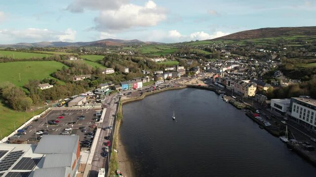 Aerial view of Bantry, small coastal town in County Cork, Ireland, bayfront buildings and street traffic on sunny day