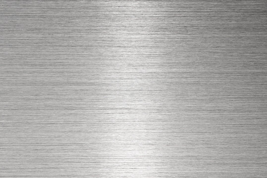 Brushed metal with reflection in midpoint. High resolution.