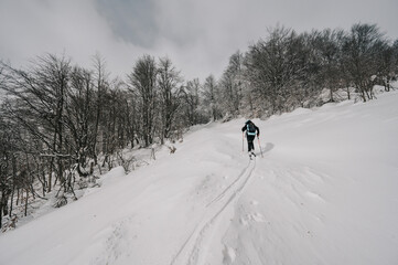 Mountaineer backcountry ski walking ski alpinist in the mountains. Ski touring in alpine landscape...