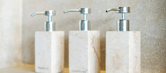Toiletries bottles in bathroom at luxury hotel or modern home. shower container set, body shower...