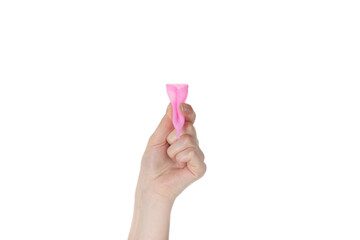A woman's hand holds in her hand in her fingers a pink vaginal cup for collecting discharge during menstruation from a woman. White background, isolate, close-up