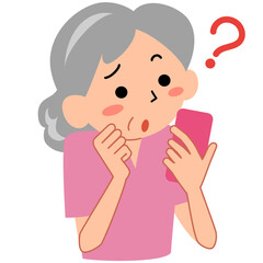 困った表情でスマホを見るシニア女性
