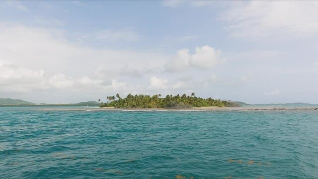 Small islet on the way to Cayo Icacos island in Puerto Rico, sideways, sunny day