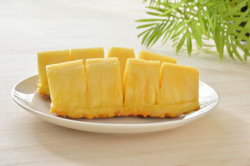 Fresh pineapple on a white plate