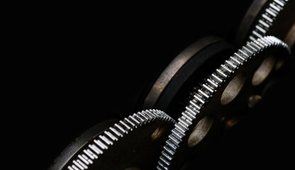 metal gears on dark background.