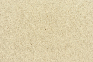 A sheet of brown recycled craft paper texture as background
