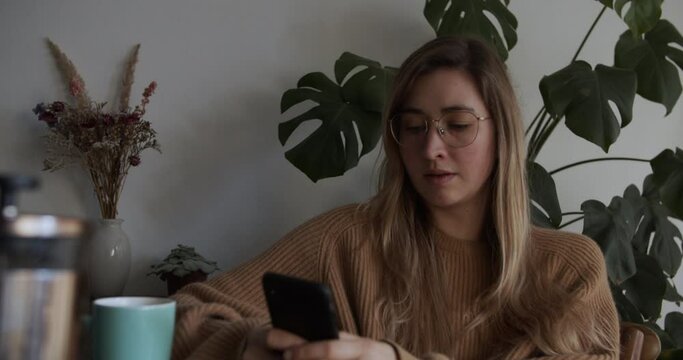 Girl puts phone on table and start her day