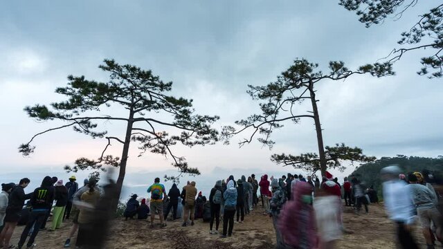Time lapse of tourists looking with a nature view at Nok Aen Cliff (Pha Nok Aen) on Phu Kradueng mountain national park