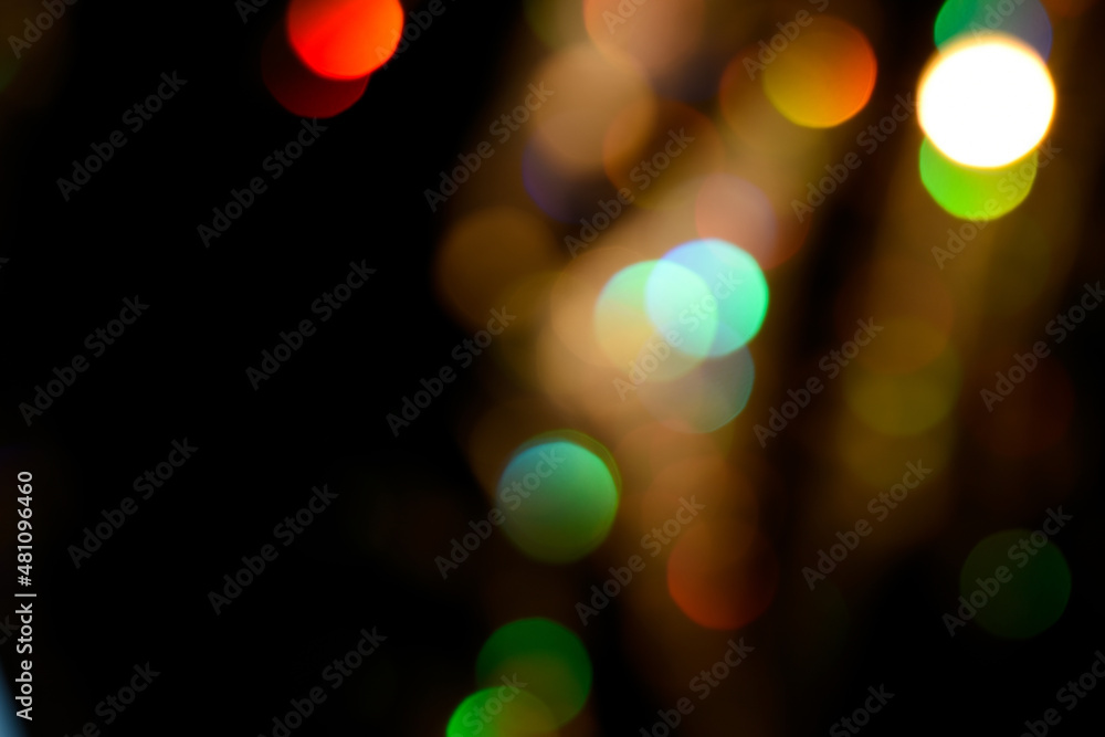 Wall mural abstract colorful glowing rainbow drops and sparkles on dark background. rainbow bokeh in lines over