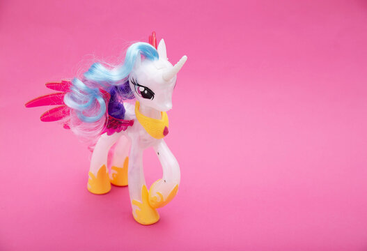 BOBRUISK, BELARUS 20.11.21: Action figure from the cartoon princess celestia on a pink background. My little poni. Copy space for text