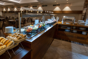 Breakfast served on a buffet table in a hotel restaurant