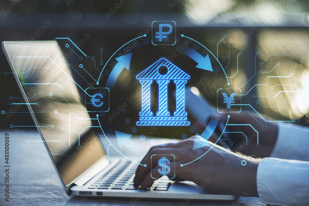Poster Close up of hands using laptop and smartphone on desktop with abstract online banking hologram on blurry background. Money, technology and trade concept. Double exposure.