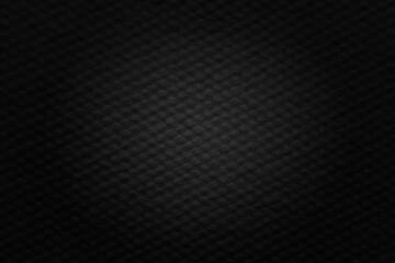 Dark background with lighting. Carbon fiber texture.
