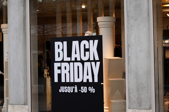 Black friday banner -50% sign logo and french text on windows store of commercial shop