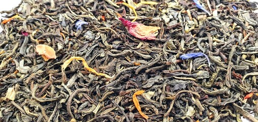 Dry tea leaves isolated. Brewed tea. Tea background. 