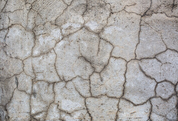 Stone antique old wall as a background or texture. Vintage background of a fortress wall in loft and grunge style with place for text and copy space.