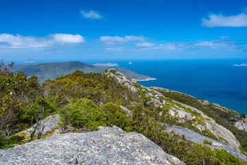 Fototapeta na wymiar Green hills and vivid blue ocean in Victoria, Australia