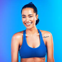 Fototapeta na wymiar Good health inspires happiness. Studio portrait of an attractive young sportswoman posing against a blue background.