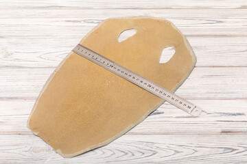 natural colored beige rays leather on the wooden table