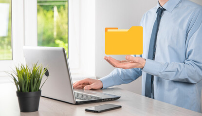 Businessman hold folder icon.Document Management System or DMS setup by IT consultant with modern computer are searching managing information and corporate files.Business processing,