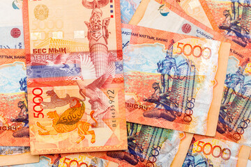 Banknotes of Kazakhstan Coins Money Kazakhstan Tenge as a background, a lot of money coins for one tenge five thousand