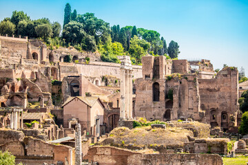 Fototapeta premium Ruins of an ancient city in Italy, old buildings in the open air, streets of ancient cities. Remains of old buildings, columns and statues on the streets of the city of Rome.