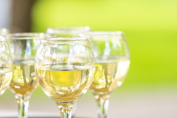 Refreshing White Wine in a Glass on a Background