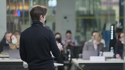 Male speaker talking to audience