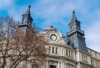 Fragment of the facade of the building of the Ministry of Agriculture with the clock and the two towers above the main entrance one of the most impressive buildings in center of Sofia, Bulgaria. 