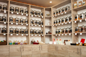 Tea shop, counter. Natural dry drink in glass jars.
