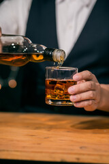 Barman pouring whiskey whiskey glass beautiful night