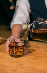 Barman pouring whiskey whiskey glass beautiful night