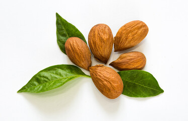 Almond kernels and nuts on a white background isolated