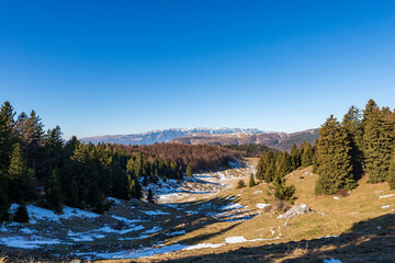 Fototapeta na wymiar Winter landscape of Lessinia Plateau (Altopiano della Lessinia) and mountain range of Monte Baldo (Baldo Mountain), Adige Valley, Italia Alps. Veneto and Trentino-Alto Adige, Italy, Europe. 