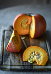 pumpkin is cut on a board