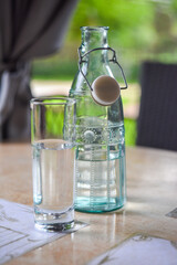 bottle of water with glass