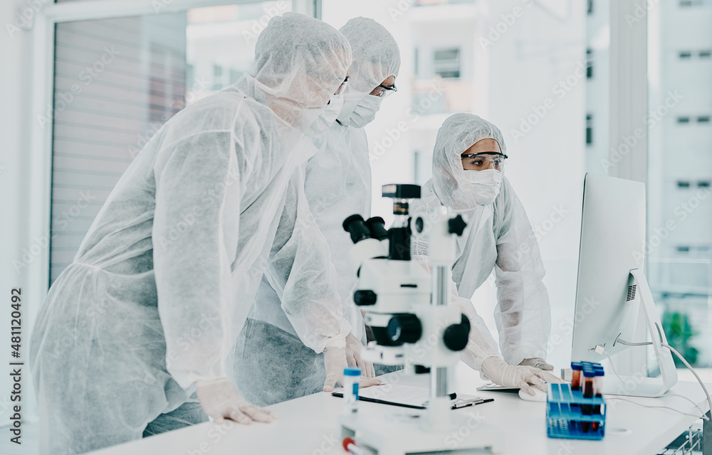 Poster the cure is so close. shot of a group of scientists in hazmat suits conducting medical research in a