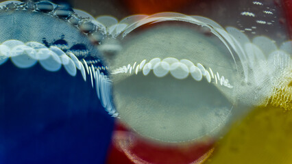 Oil drops on water. Colorful abstract background, close up macro shot. 