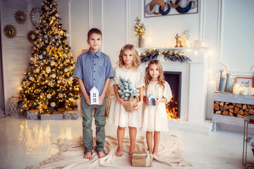 children, new year, new year's interior, christmas tree, photo shoot in the studio, family, brother, sisters