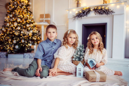 children, new year, new year's interior, christmas tree, photo shoot in the studio, family, brother, sisters