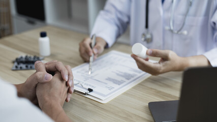 Medical consultation, Doctors advise and give advice..medicines are given to patients in the examination room of a hospital or clinic, Diagnosis, Medical service, Healthy lifestyle concept...