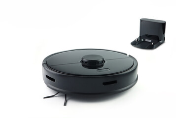 nice black modern automatic scan robotic vacuum for cleaing the dirty floor is isolated on white background with its charging dock