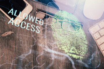 Fototapeta na wymiar Double exposure of finger print over table with phone. Top view. Concept of mobile security.