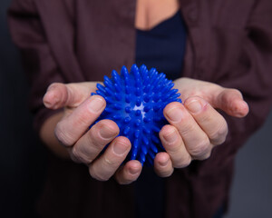 Woman holding a rubber ball